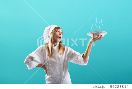 Happy chef cooks a new sweet creative recipe 96223314