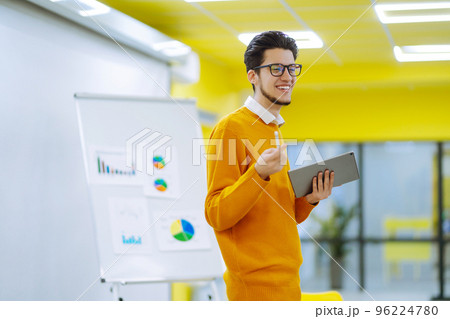 Male business coach speaker giving flipchart presentation 96224780