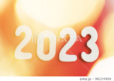 wooden number 2023 on christmas shiny gold and red background. sparkle festive blurred bokeh wooden number 2023 on christmas shiny gold and red background. sparkle festive blurred bokeh 96224909
