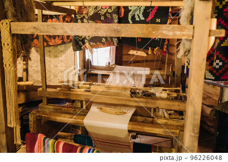 A loom in an old wooden house, made in the 19th century 96226048