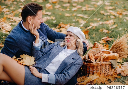 Happy couple enjoying golden autumn spring season in the park Happy couple enjoying golden autumn spring season in the park 96228557