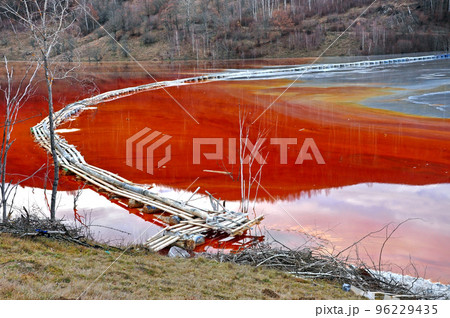 Pollution of a lake with contaminated water 96229435