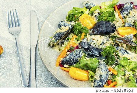 Yummy vegetable salad with seafood. Yummy vegetable salad with seafood. 96229952