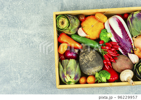 Set of uncooked vegetables in a wooden box Set of uncooked vegetables in a wooden box 96229957