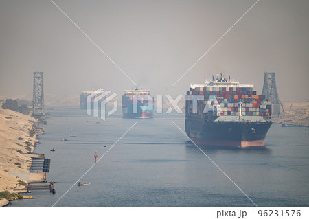 Many cargo ships navigate by Suez Canal, Egypt. Concept of distribution, shipping and delivery 96231576