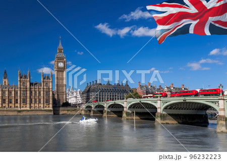 Big Ben with red buses on bridge over Thames river with boat in London, England, UK Big Ben with red buses on bridge over Thames river with boat in London, England, UK 96232223