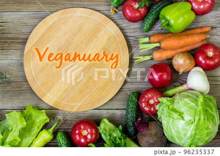 Flat lay with many raw vegetables. Vegetarian and vegan diet month in january called Veganuary. Flat lay with many raw vegetables. Vegetarian and vegan diet month in january called Veganuary. 96235337