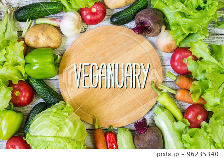 Flat lay with many raw vegetables. Vegetarian and vegan diet month in january called Veganuary. 96235340