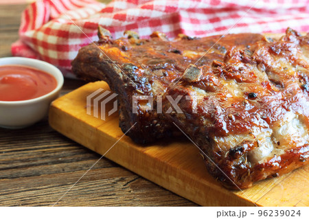 grilled pork ribs on a cutting board grilled pork ribs on a cutting board 96239024