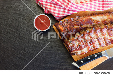 grilled pork ribs on a cutting board grilled pork ribs on a cutting board 96239026