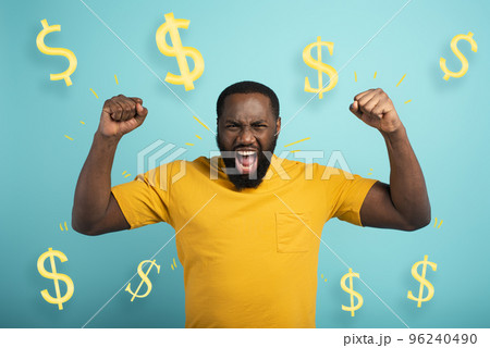 Boy wins money. Amazed and surprised expression face. Light blue background 96240490