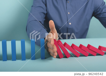 Concept of covid19 coronavirus pandemic with falling chain like a domino game. Contagion and infection progression. Cyan background Concept of covid19 coronavirus pandemic with falling chain like a domino game. Contagion and infection progression. Cyan background 96240542
