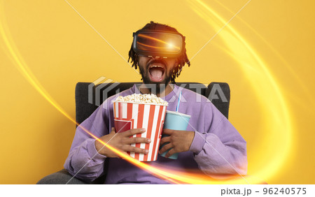 Man with VR glasses play with a virtual videogame 96240575