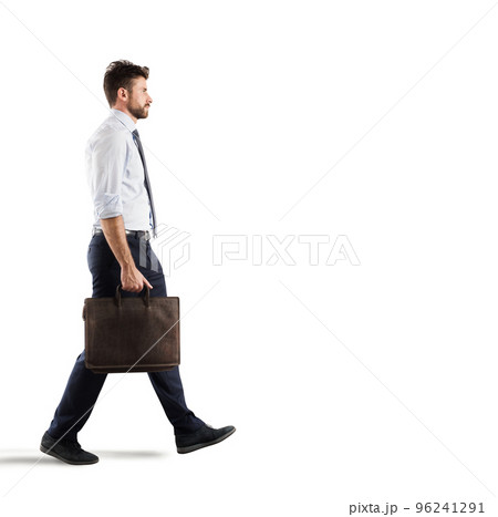Businessman walks on white background Businessman walks on white background 96241291