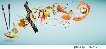 Pieces of delicious japanese sushi frozen in the air. Isolated on pastel blue background Pieces of delicious japanese sushi frozen in the air. Isolated on pastel blue background 96242525