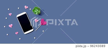 Smartphone with hearts and a succulent 96243089