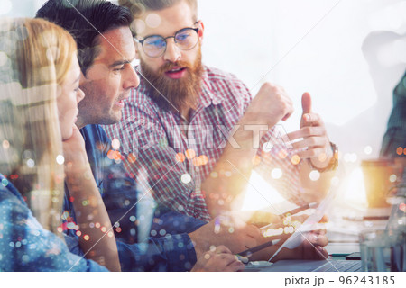 Business people that work together in office. Concept of teamwork and partnership Business people that work together in office. Concept of teamwork and partnership 96243185