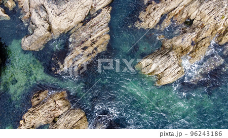 A lot of boulders in the sea water. Coastal cliffs of the North Atlantic. Seaside beautiful nature. Dramatic seascape of the north of Europe. Drone photo. 96243186