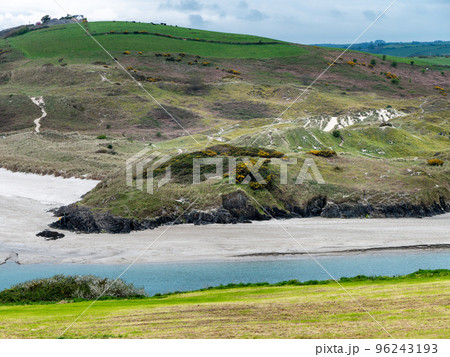 Picturesque hills in the south of Ireland, a view of the Clonakilty seashore. Cloudy, rainy weather. Wild Atlantic Way. Nature of Europe. Beautiful places. 96243193