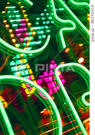 Neon abstract background. Glowing sign on the window in the city 96243414