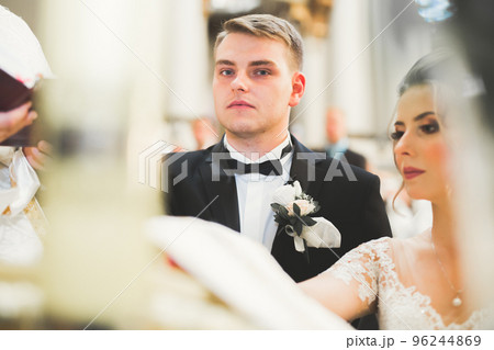 Wedding couple bide and groom get married in a church 96244869