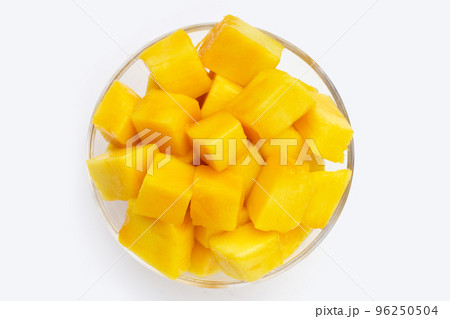 Tropical fruit, Mango cube slices in white bowl on white background. Copy space 96250504