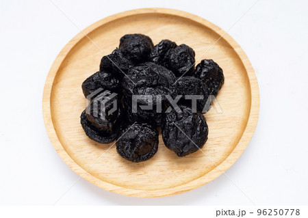 Dried prunes on white background 96250778