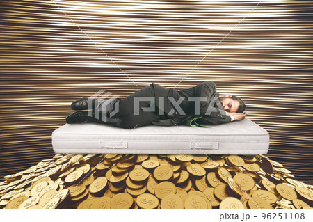 Business man sleeps with money under the mattress to avoid the risk of investing in the financial market Business man sleeps with money under the mattress to avoid the risk of investing in the financial market 96251108