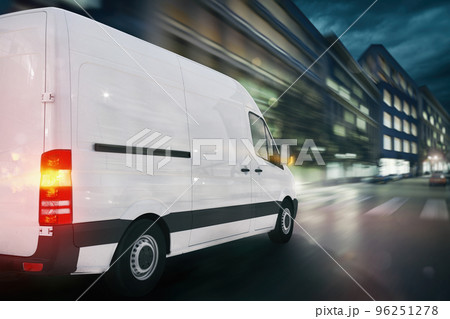 Super fast delivery of package service with a fast moving van on cityscape Super fast delivery of package service with a fast moving van on cityscape 96251278