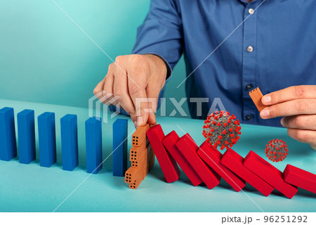 Concept of covid19 coronavirus pandemic with falling chain like a domino game. Contagion and infection progression stopped by a hand of a doctor. Cyan background 96251292