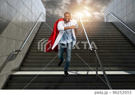 Medic acts like a superhero in hospital to fight pandemic of covid19 coronaviruses. Blue background 96252055