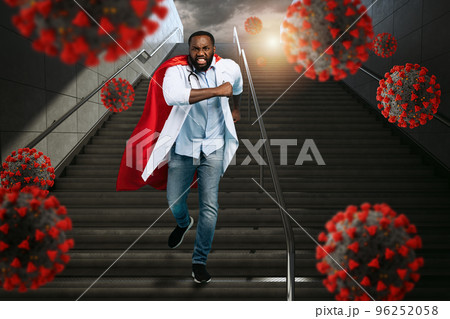 Medic acts like a superhero in hospital to fight pandemic of covid19 coronaviruses. Blue background 96252058