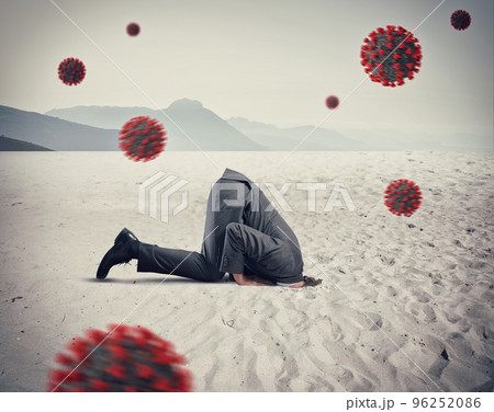 Man hides himself like an ostrich due to coronavirus covid19 problem in the air Man hides himself like an ostrich due to coronavirus covid19 problem in the air 96252086