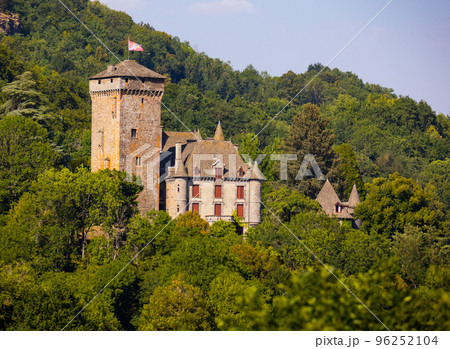 Medieval Pesseils Castle on hillside among greenery on summer, France Medieval Pesseils Castle on hillside among greenery on summer, France 96252104