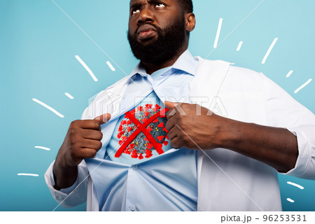 Medic acts like a superhero to fight pandemic of covid19 coronaviruses. Blue background 96253531