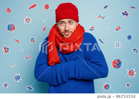 Boy caught a cold and is surrounded by viruses and bacteria. Studio on Cyan background 96253550