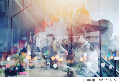 Businessmen that work together in office. Concept of teamwork and partnership. double exposure Businessmen that work together in office. Concept of teamwork and partnership. double exposure 96253615