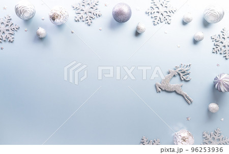 Christmas and new year background concept. Top view of Christmas star and snowflake on pastel blue background. Christmas and new year background concept. Top view of Christmas star and snowflake on pastel blue background. 96253936
