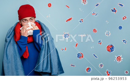 Boy caught a cold and is surrounded by viruses and bacteria. Studio on Cyan background 96253953