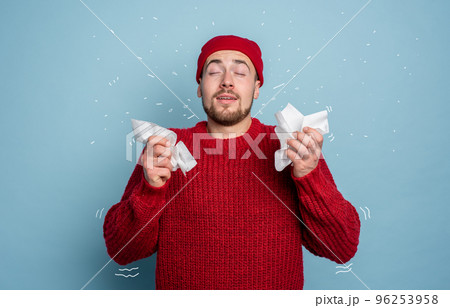 Boy caught a cold and has cold chills. Studio on Cyan background 96253958