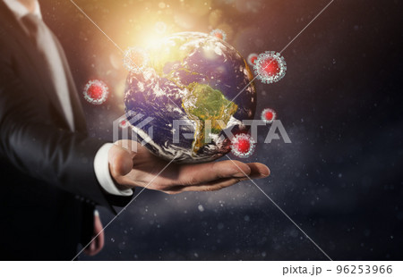 Worldwide problem of covid 19 viruses with a glass globe Worldwide problem of covid 19 viruses with a glass globe 96253966