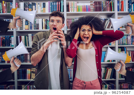 Student are worried and annoyed due to high volume of megaphone in a library Student are worried and annoyed due to high volume of megaphone in a library 96254087
