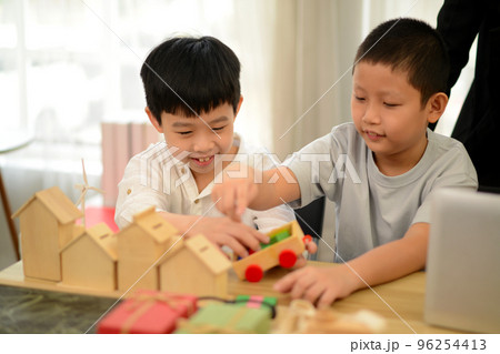 Children playing with wooden toys, toys, education, white background, wooden concept. Children playing with wooden toys, toys, education, white background, wooden concept. 96254413