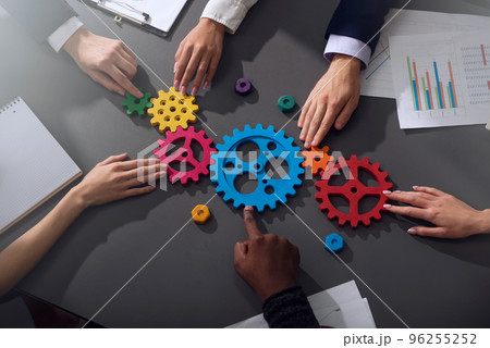 Business team connect pieces of gears. Teamwork, partnership and integration concept 96255252