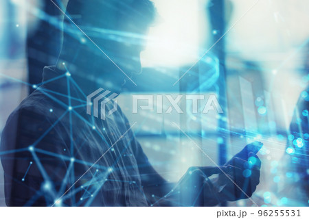 Young man using a mobile phone connected to internet. Double exposure and network effect 96255531