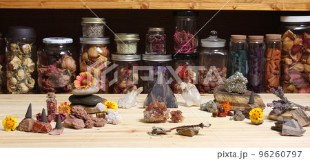 Meditation Altar With Rock Crystals and Flowers. Jars of Herbs in Background Meditation Altar With Rock Crystals and Flowers. Jars of Herbs in Background 96260797