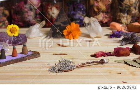 Dried Lavender and Rose Petals on Table With Incense Cones and Crystals 96260843