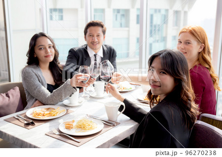 Happiness team young business people in party celebrate success holding glass of wine cheer. Happiness team young business people in party celebrate success holding glass of wine cheer. 96270238