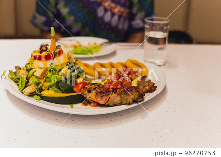 Grilled chicken with vegetables salad on a plate. Healthy Food Grilled chicken with vegetables salad on a plate. Healthy Food 96270753