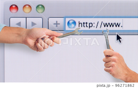 Hand with wrench over a internet web browser. concept of fix errors 96271862
